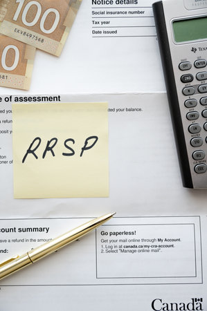 Calgary, Alberta - January 14, 2023:  Items related to tax planning in Canada.のeditorial素材