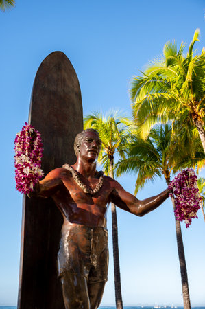 Honolulu, Hawaii - December 26, 2022: Duke Kahanamoku statue in front of Kuhio Beach Park in Waikiki was a Native Hawaiian competition swimmer who popularized the ancient Hawaiian sport of surfingのeditorial素材