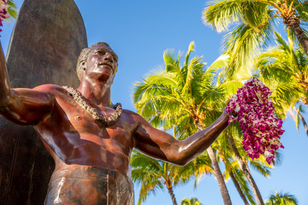 Honolulu, Hawaii - December 26, 2022: Duke Kahanamoku statue in front of Kuhio Beach Park in Waikiki was a Native Hawaiian competition swimmer who popularized the ancient Hawaiian sport of surfingのeditorial素材