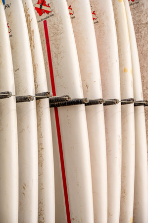 Honolulu, Hawaii - January 1, 2023: Surfboards lined up for rent  in Waikiki.のeditorial素材