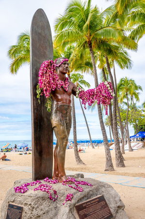 Honolulu, Hawaii - January 1, 2023: Duke Kahanamoku statue in front of Kuhio Beach Park in Waikiki was a Native Hawaiian competition swimmer who popularized the ancient Hawaiian sport of surfingのeditorial素材