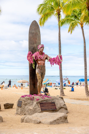 Honolulu, Hawaii - January 1, 2023: Duke Kahanamoku statue in front of Kuhio Beach Park in Waikiki was a Native Hawaiian competition swimmer who popularized the ancient Hawaiian sport of surfingのeditorial素材