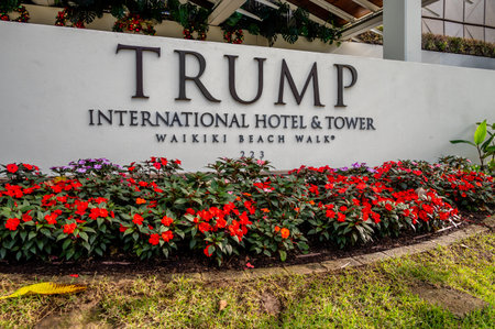 Honolulu, Hawaii - January 1, 2022:  Sign for Trump International Hotel & Tower on the Waikiki Beach Walk.のeditorial素材