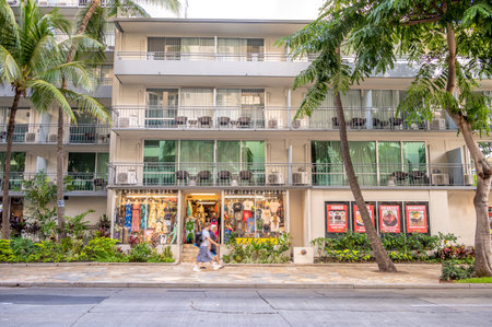 Honolulu, Hawaii - January 1, 2023: Hawaiian clothing store in the evning in Waikiki.のeditorial素材