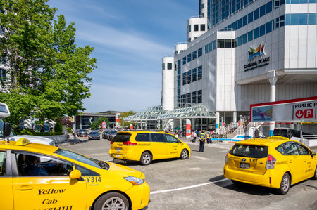Vancouver, British Columbia, Canada - July 24, 2022: Taxi cabs bringing thousands of tourists to...