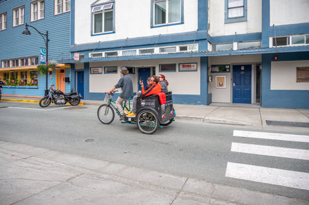 Juneau, Alaska - July 27, 2022: Central Juneau Alaska is home to many tourist shops, restaurants and landmarks. Bike tour.のeditorial素材