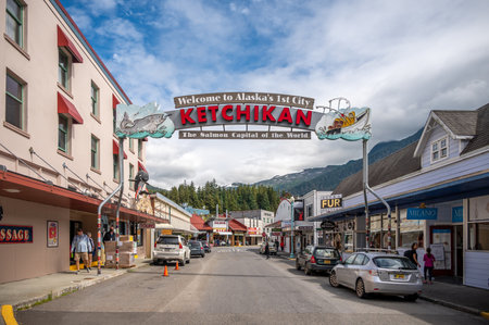Ketchikan, Alaska - July 29, 2022: Views of the historic wooden buildings in the popular cruise destination of Ketchikan.  Salmon Capital of the World Sign.のeditorial素材