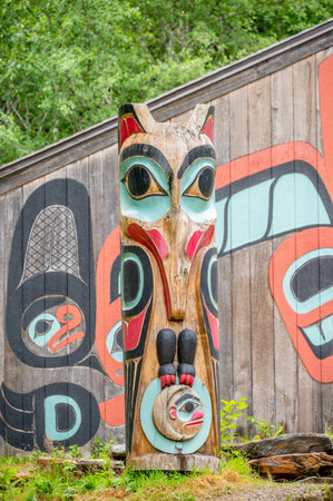 Saxman, Alaska - July 29, 2022: Tlinget totem poles, long house and traditional art.のeditorial素材