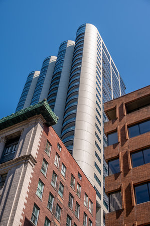 Vancouver, British Columbia - May 27, 2023: Looking up at a mix of heritage and modern skyscrapers.のeditorial素材