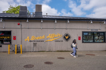 Vancouver, British Columbia - May 27, 2023: Views of Vancouver's landmark attraction - Granville Island Public Market, restaurants, and shops.のeditorial素材
