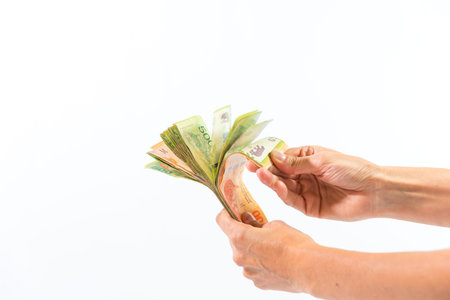 hand with cookie, lack of money, poverty, white background, finance concept, bankrupt economy,...