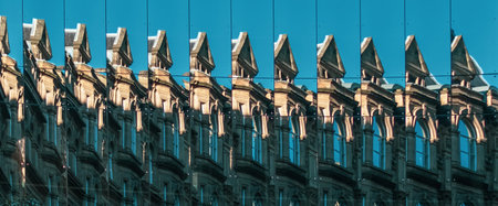 Building Reflected in Multiple Mirrored Windows. Mirror Reflection. Buildings in the Sun Reflected....