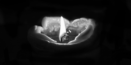 Candle with black background.の写真素材