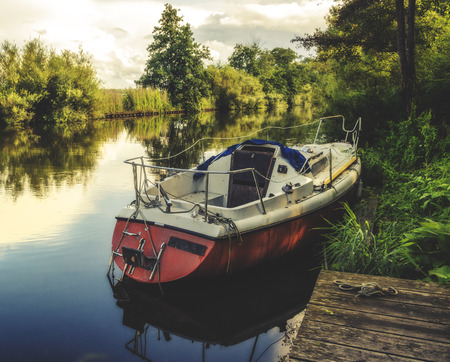 Boat Floating in a beautiful Riverの写真素材