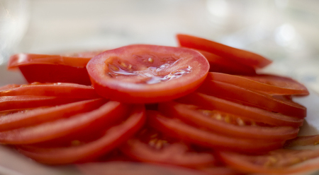 Tomato slizes on a plateの写真素材