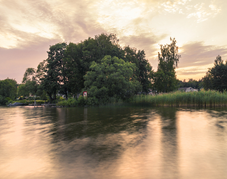 Beautiful summer season specific photograph. Summer archipelago with beautiful sunlights and waterline. Lovely lights and colors. Summer environment.の写真素材