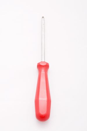 A red handled screwdriver lays flat on whiteの写真素材