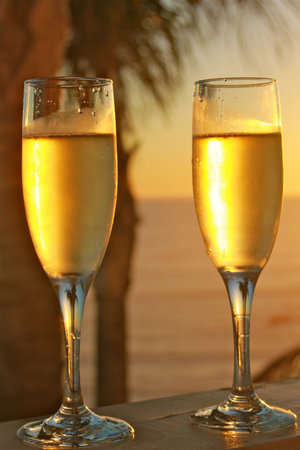 Champagne glasses at sunsetの写真素材