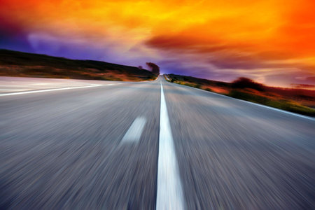 road on with a blue sky in motion