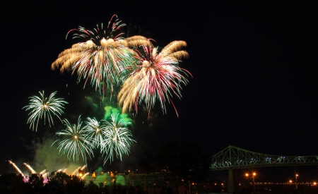 Multiple Firework Bursts over a bridge in Montrealの写真素材