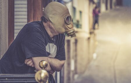 from the home-confined window with mask by Coronavirus, pandemic conceptの写真素材