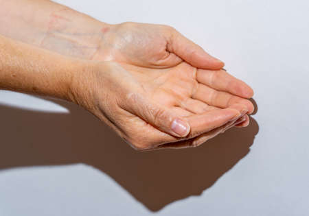 empty woman's hands in the helping positionの写真素材