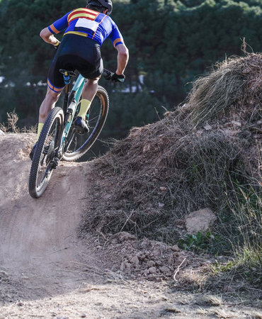 Mountain biking on a training track in action.