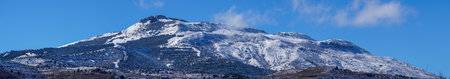 snow-capped mountains, blue skies, treesの写真素材