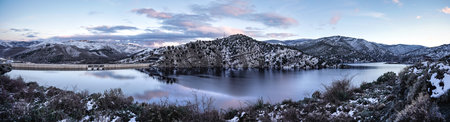 sunset on the lake, reflections of mountains and cloudsの写真素材