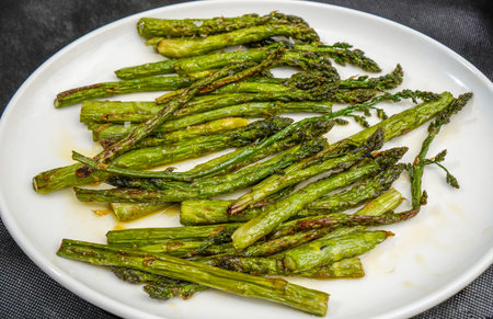 Grilled green asparagus with olive oil and saltの写真素材