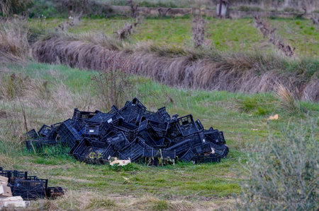 Plastic boxes of fruit and other products, rubbish and waste in the fields and in the mountains.の写真素材