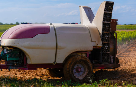 tractor tank spraying to the vineyardの写真素材