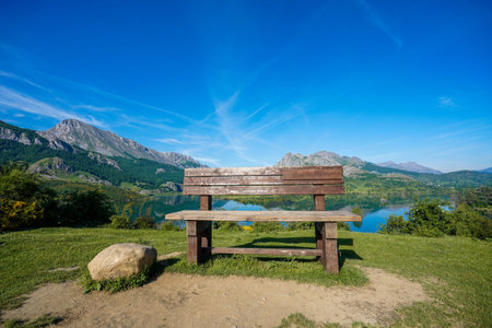 The highest wooden bench in the community that serves as a viewpoint to contemplate the Riaño reservoir.の写真素材