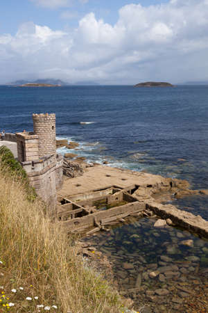watchtower on a hillside overlooking the sea. Baiona, Spain.の写真素材