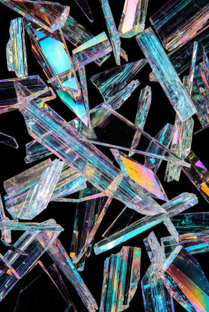 Abstract background made of transparent pieces of glass, closeup of photoの素材