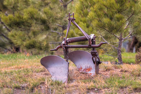 Old rusty antique vintage farm plow equipmentの写真素材