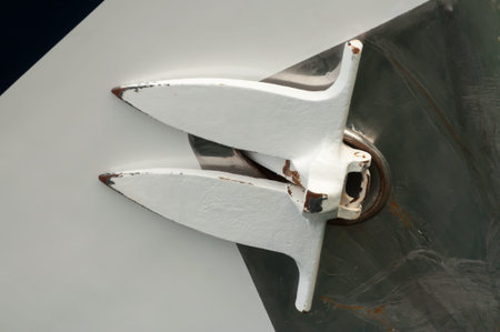 Up close view of an anchor of a yacht, retracted against the hull of the vessel.の写真素材