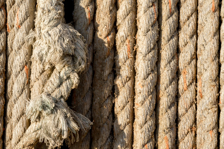 Natural rope made of fibre as background with two ends spliced together in the foreground.の写真素材
