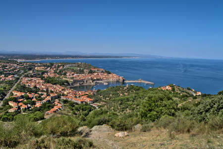 Beautiful panoramic view of the town of Collioure, with the calm sea, seen from the fort of San Telmoの写真素材
