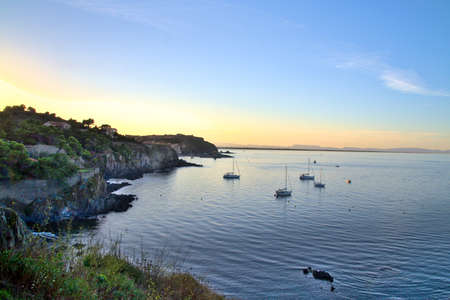 Boats at anchor in Collioure Bay, with calm seasの写真素材