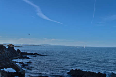 Boat sailing through a calm Mediterranean seaの写真素材