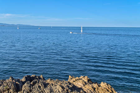 Boat sailing through the Mediterranean in calmの写真素材