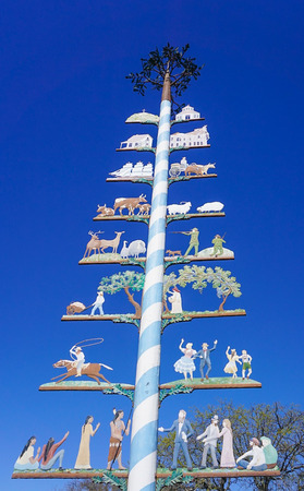 Colorful Maypole in Marktplatz in Fredericksburg, Texas erected in 1991 with symbols representing the town's history and an Autumn Ocktoberfest celebration.のeditorial素材