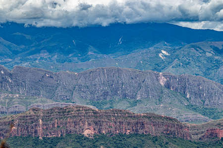 A canyon with a mountain in the backgroundの写真素材