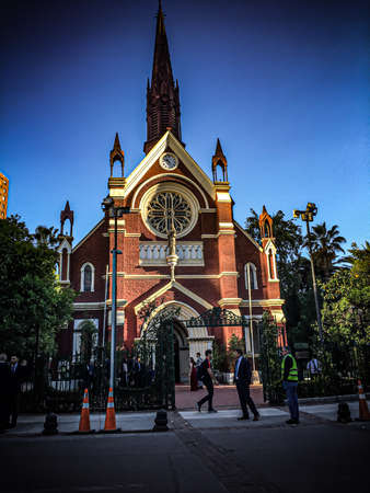 A clock tower in front of a buildingの写真素材
