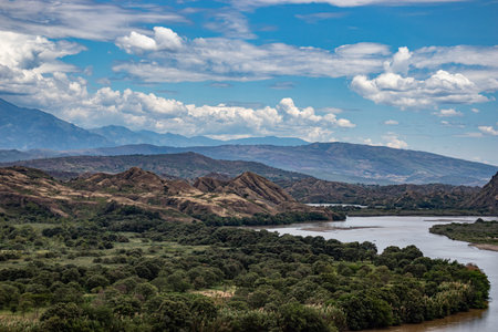 A large body of water with a mountain in the background