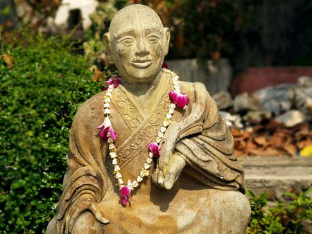 Satue of a Buddhist Monk at Wat Phoの写真素材