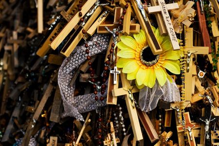 Unique photo of a pile of crosses, with sunflower. の写真素材