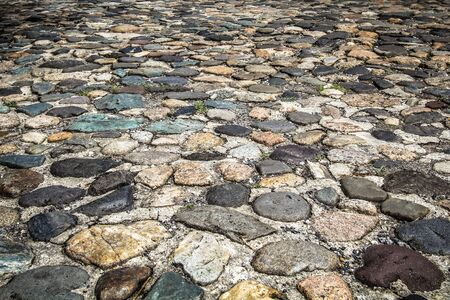 Unique, colorful, cobblestone road in Charleston, South Carolinaの写真素材