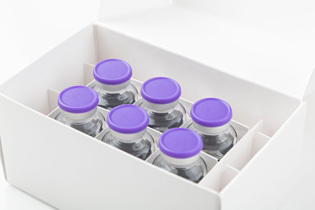 Box with Covid19 vaccines on white background, ready for vaccination.の写真素材